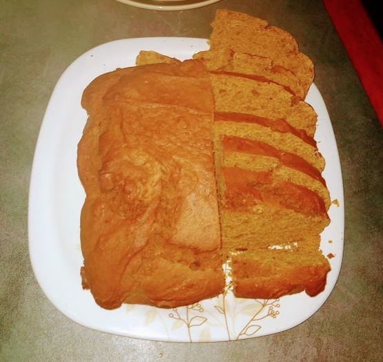 brownish loaf of bread on a plate